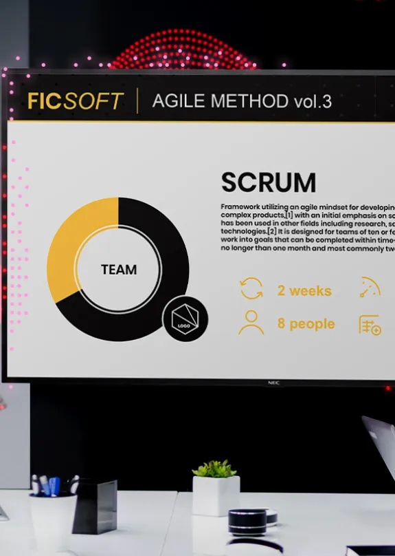 Three people having a meeting looking at a Sharp AV 